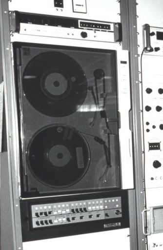 A sophisticated tape recording device in action.